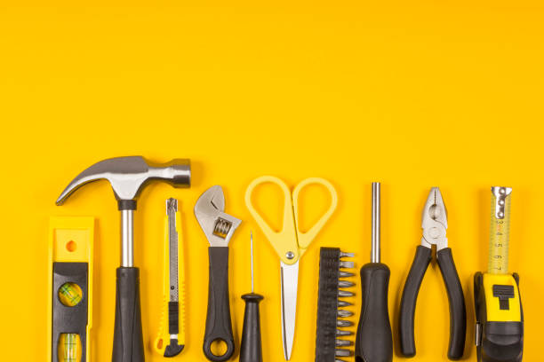 istock Set of various construction tools. Tools for home repair. Work at a construction site. On a yellow background. Flatlay. 1157142476