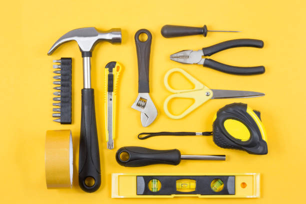 istock Set of various construction tools. Tools for home repair. Work at a construction site. On a yellow background. Flatlay. 1157142504