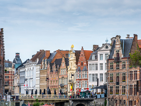 view of the River Leie and historic buildings on the Korenlei in the center of Gent.