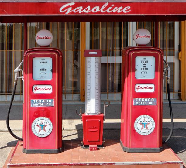 Decorative vintage red fuel pumps Texaco Pradamano, Italy. June 16 2019. Decorative vintage fuel pump Texaco in front of  Rock  60 club, recently opened vintage gas pumps stock pictures, royalty-free photos & images