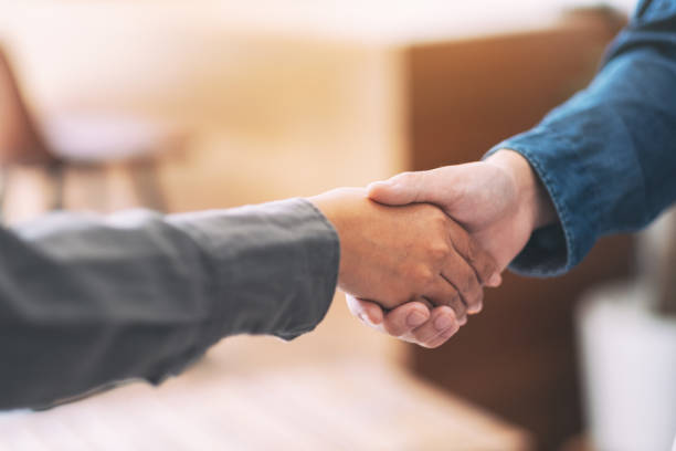 istock businessman shaking hands after the meeting 1157150891