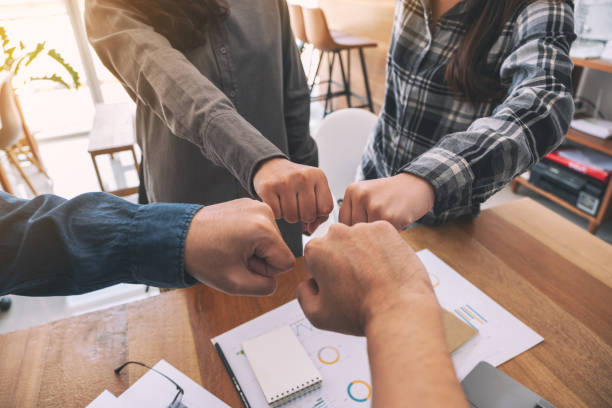 istock Group of business teamwork join their hands together 1157151052