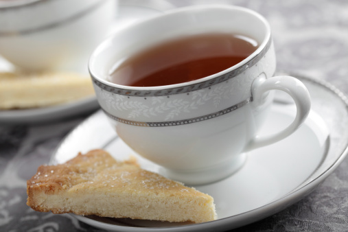 Cup of black tea and the slice of shortbread