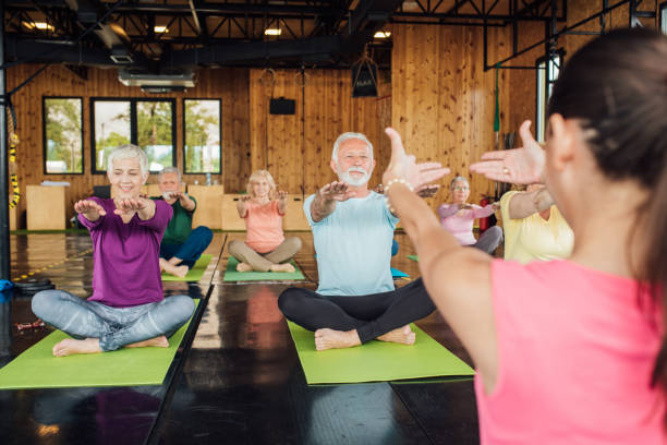 istock People exercising yoga 1157155112