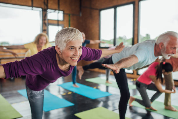 istock Older woman exercising with friends 1157155116
