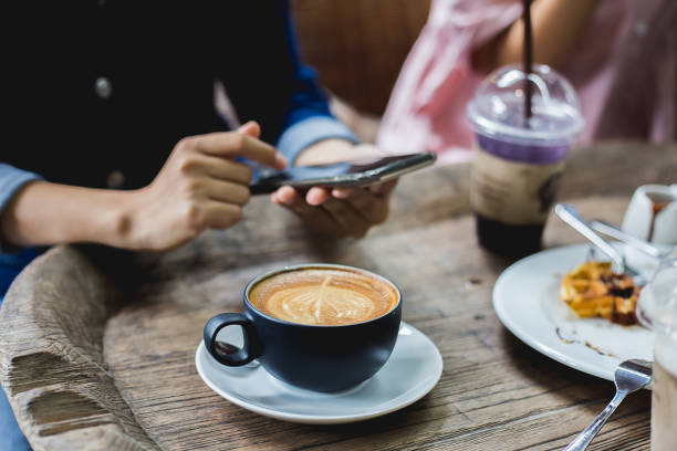 istock Lifestyle of people using internet at coffee cafe on holidays. 1157155370