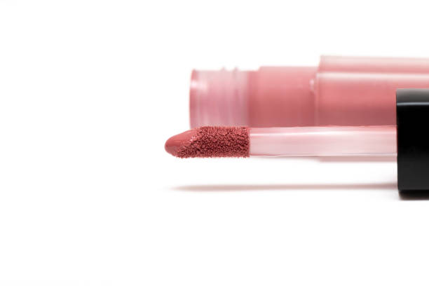 istock Liquid lipstick. Brush for makeup lips on white background. 1157156338