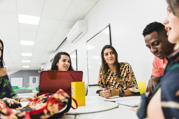 istock Group a of college students while working together in classroom 1157159445