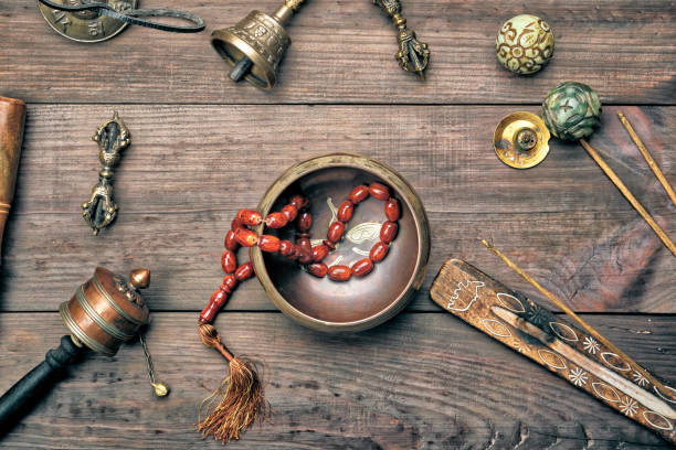 istock Copper singing bowl, prayer beads, prayer drum and other Tibetan religious objects for meditation 1157162362