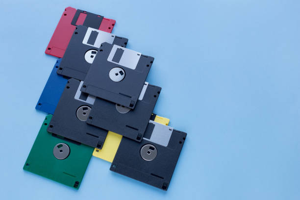 istock Multi-colored flexible disks isolated on a blue background. Copy space for your text. 1157162368