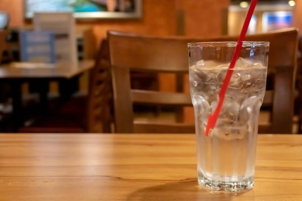 istock Glass water drink with tube on table 1157164267