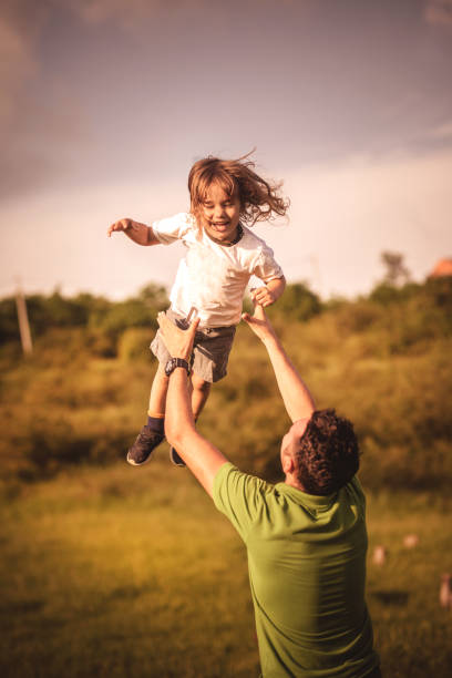 istock Father  and child having fun outdoors. 1157166141