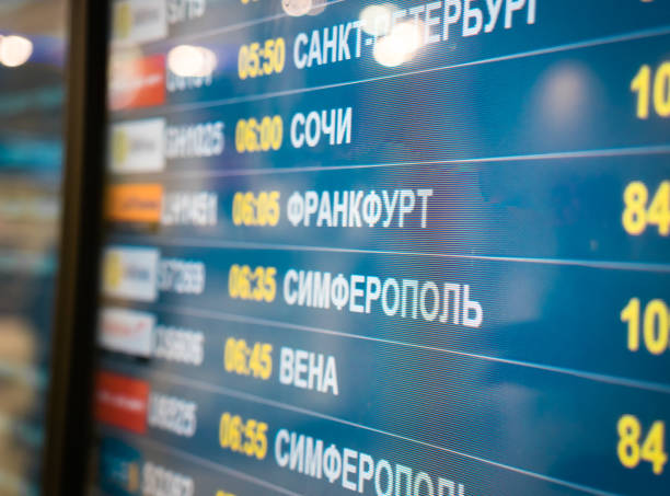 istock Electronic scoreboard flights and airlines. Destinations wrote in Russian language translate are: Simferopol, Bahrain, Minsk, St.Petersburg, Sochi, Frankfurt, Vienna. Airport flight information arrival displayed on departure board, flight status changing 1157167565