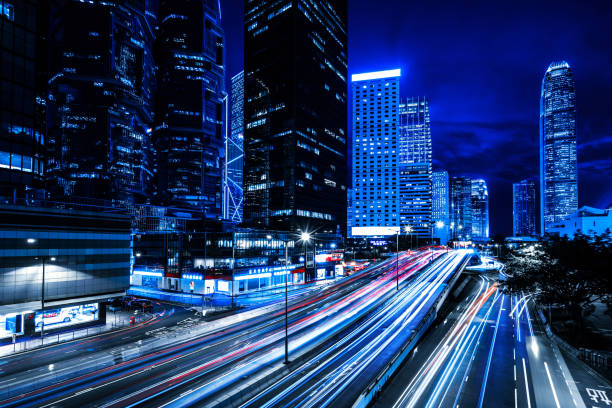 istock Moving car with blur light through city at night 1157167576