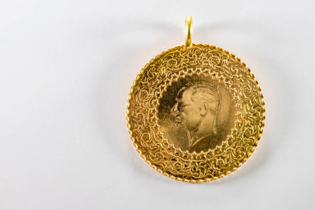 istock close up half Turkish gold lira on the white background 1157170529