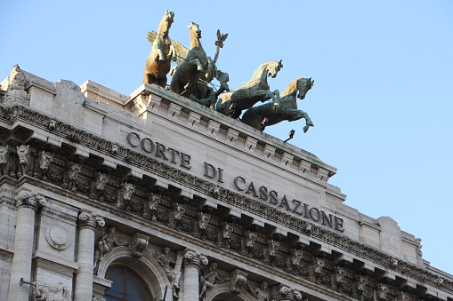 Rome Italy, March 2019, low photo of the Corte Di Cassazione, supreme court looking up at the sculpture of horses and carriage.