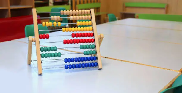 colored wooden abacus to learn how to count numbers on a decimal or ten basis