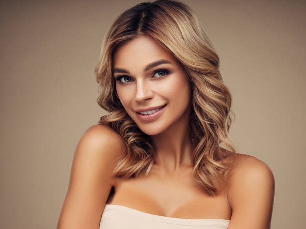istock Young brown haired beautiful model with long and curly hair. 1157174964