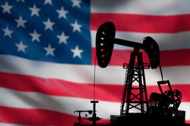 istock silhouette of oil drilling pump on background 1157175064