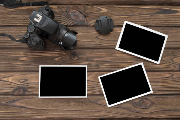 istock photo camera on a wooden background. 1157180778