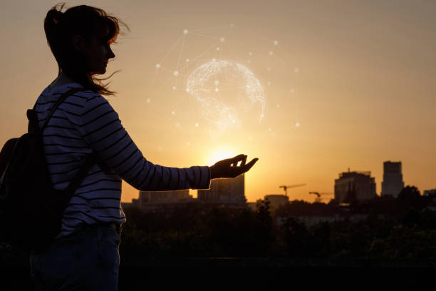 istock Woman shows the global Internet network . 1157182094