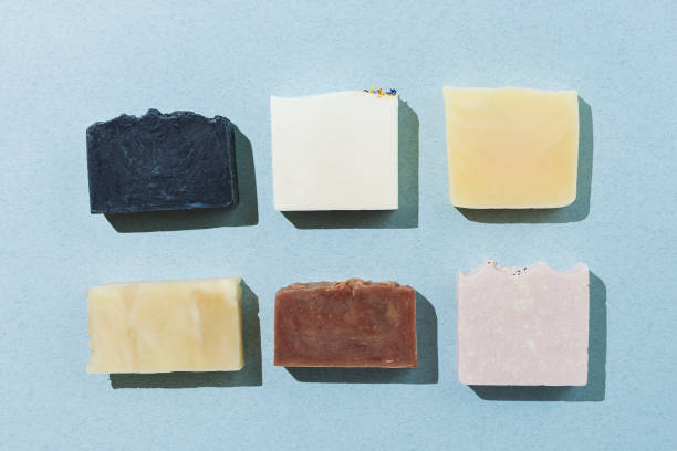 istock Flatlay of various natural hand-made soaps on blue 1157189291