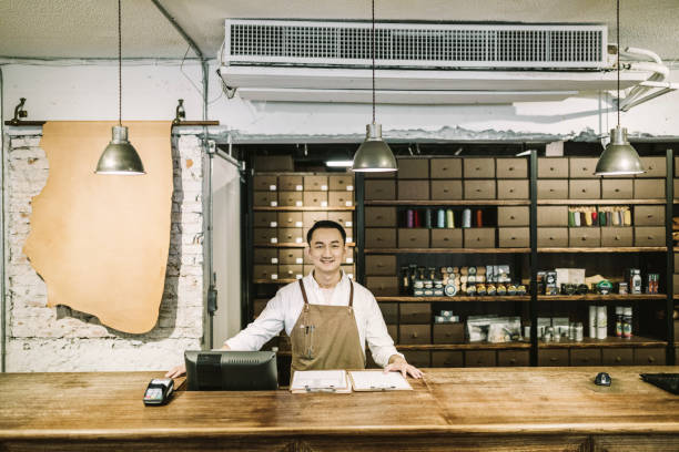 istock Portrait of confident owner standing at checkout 1157189696