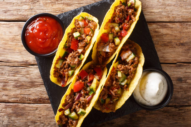 istock Mexican tacos stuffed with minced beef and vegetables close-up. horizontal top view 1157190278