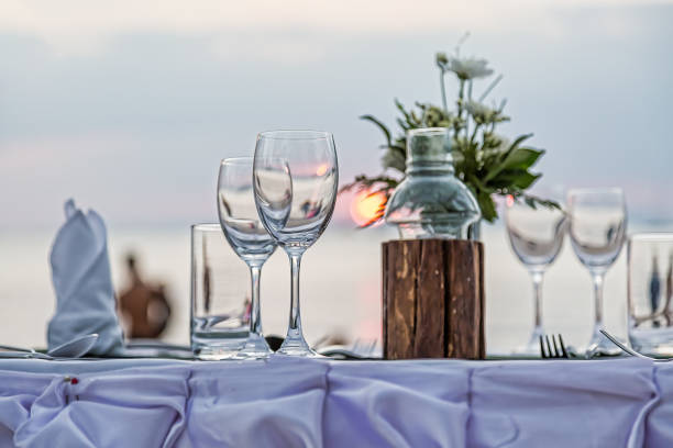 istock Serving for a romantic dinner on the beach at sunset. 1157191280