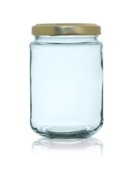 istock Empty glass jar closed by a metal cover with reflection, isolated on a white background 1157192499