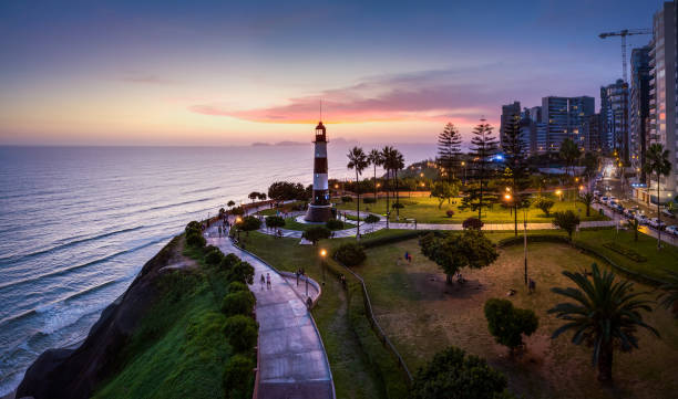 Aerial Lima views of Lima, Peru Panoramic view of Miraflores with Lighthouse and Ocean at sunset in Lima, Peru lima stock pictures, royalty-free photos & images