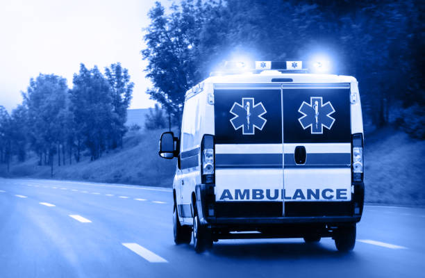 istock Ambulance van on highway with flashing lights 1157196415