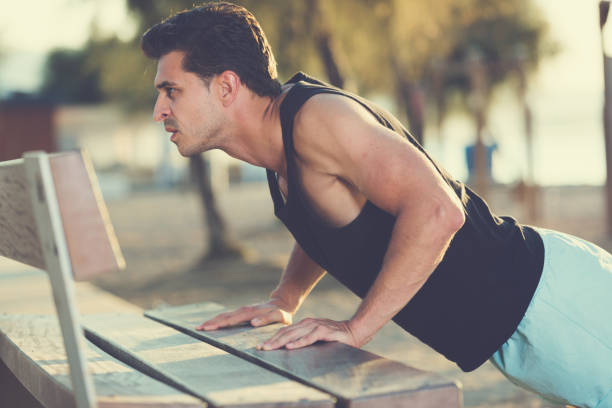 istock Fit man pushing up outdoor 1157196729