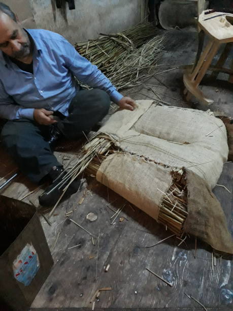 Şanlıurfa, Turkey April 25, 2019:Turkish men prepare old fashioned saddle in Anatolian artisan street,
