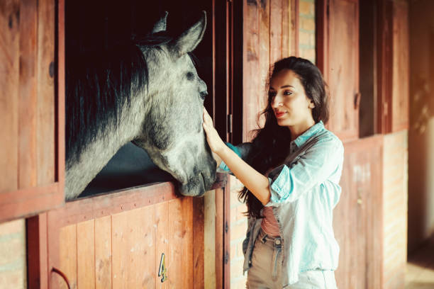 istock Woman with horse 1157199058