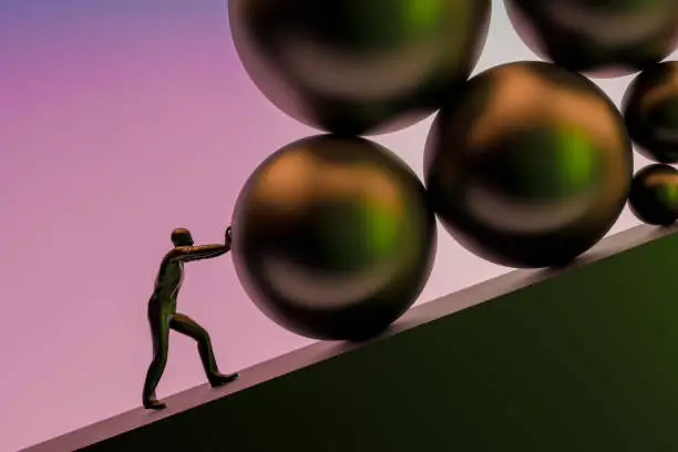 Photo of Businessman pushing large stone uphill