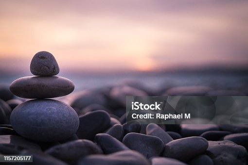 istock Sunset with pebbles on beach in Nice, France. 1157205177