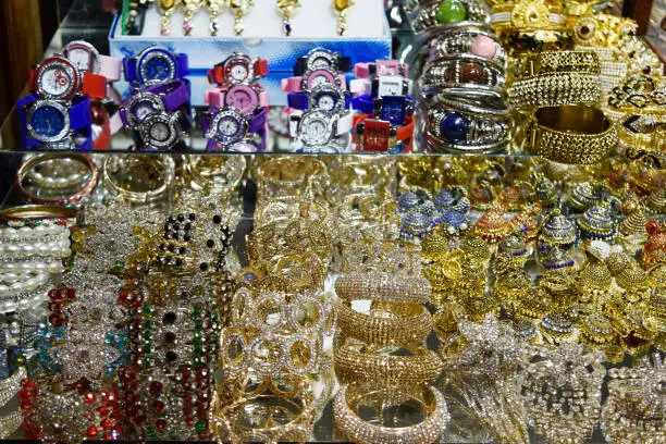 Photo of gold and silver with watches market outdoor