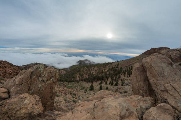 istock Mountains around volcano Teide, partly covered by the clouds. Bright blue sky. Teide National Park, Tenerife, Canary Islands, Spain 1157208897