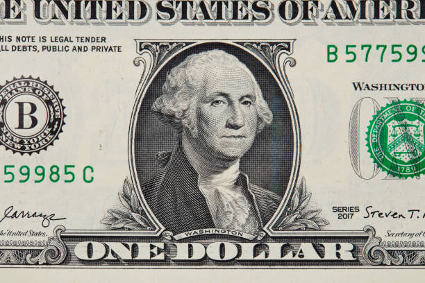 istock Close up of one us dollar bill isolate on white background. 1157209537