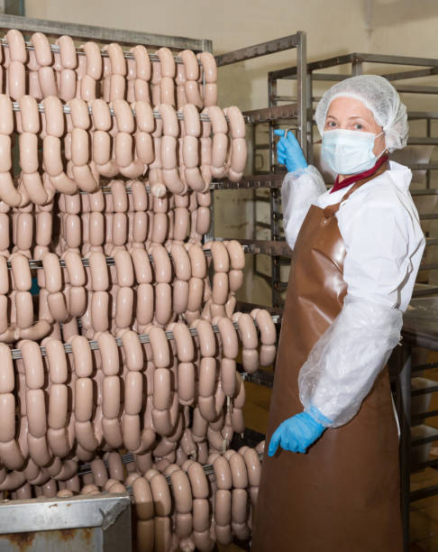 istock Workwoman carrying sausage trolley 1157212170