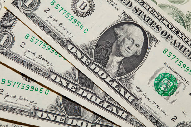 istock money background - american dollars 1157212331