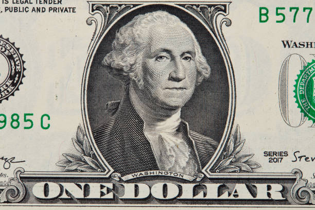 istock Close up of one us dollar bill isolate on white background. 1157213601
