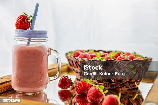 istock Fresh earth yeast milk with fresh strawberries in a basket 1157213698