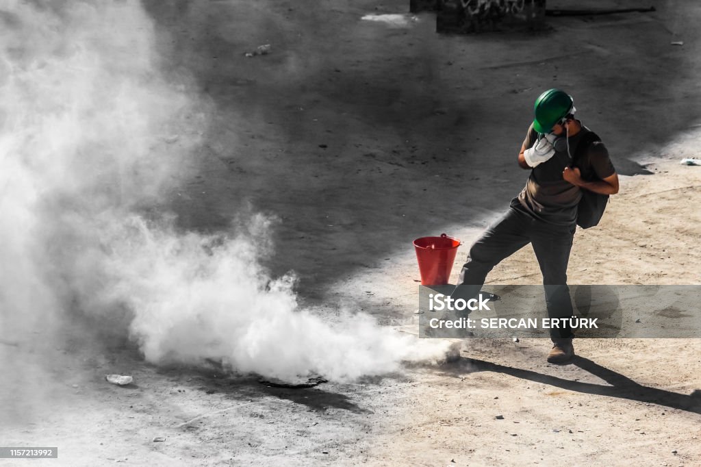 a single male rioter trying to get rid of tear gas bomb a single male rioter trying to get rid of tear gas bomb
Location: Turkey Istanbul / Taksim
Incident: Gezi protests Tear Gas Stock Photo