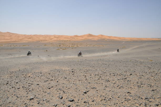 istock Moroccan landscape - desert motorcyclists 1157215670