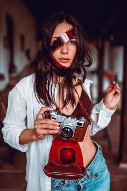 istock Female Beauty Playing With Vintage Camera 1157218312