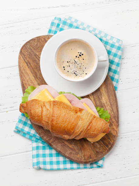 istock Coffee and croissant sandwich 1157218332