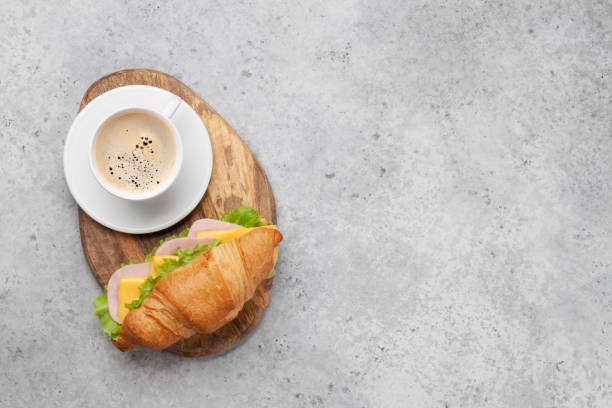 istock Coffee and croissant sandwich 1157218382