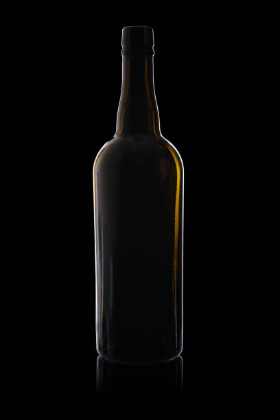 istock Empty bottle from dark glass isolated on a black background with reflection 1157219846